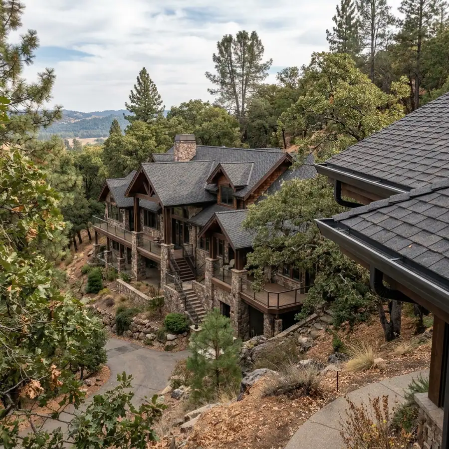 Multi-level hillside estate in El Dorado Hills with complex rooflines under oak and pine cover — gutter cleaning in El Dorado Hills